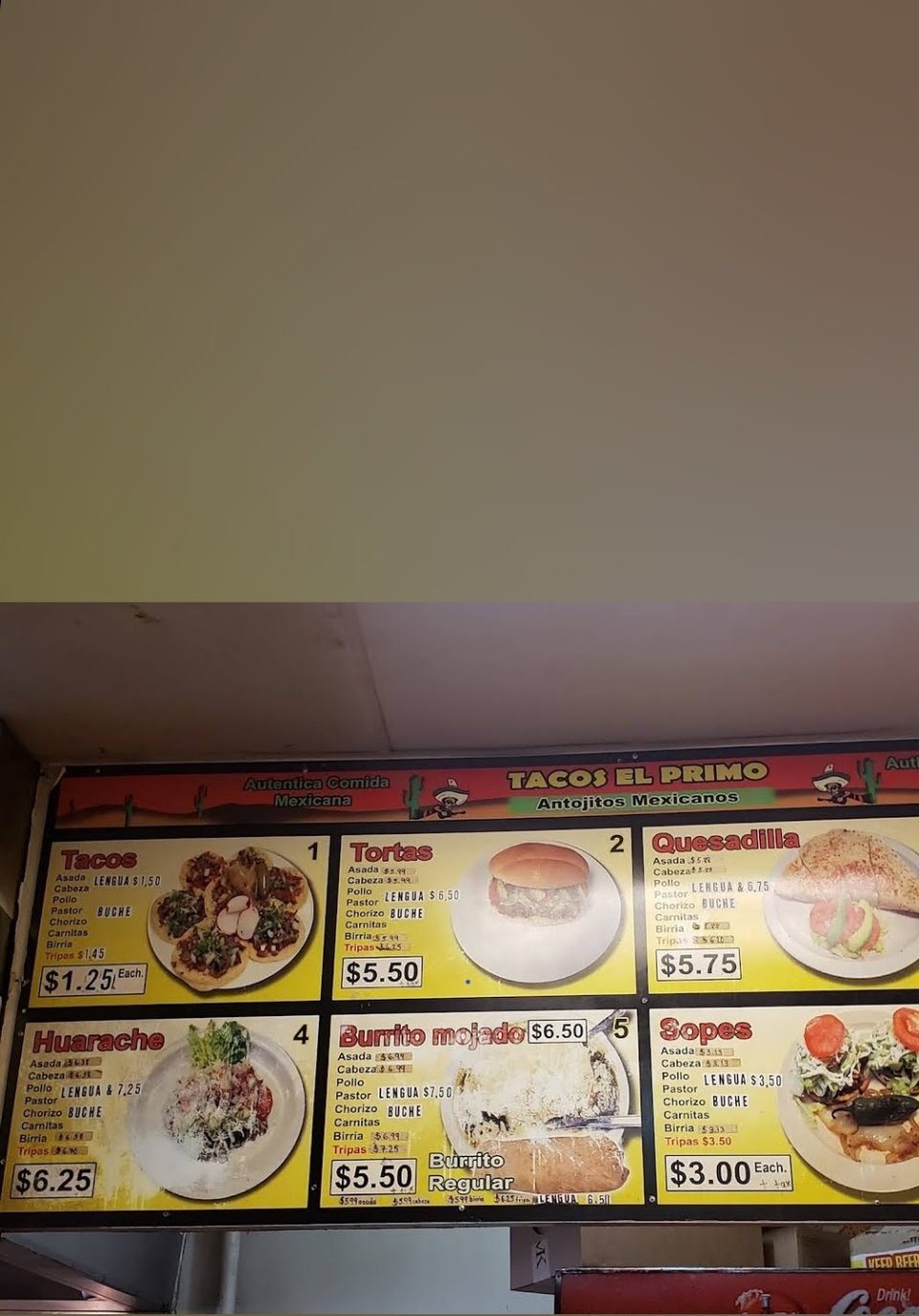 Close-up of menu sections for breakfast and entrées.